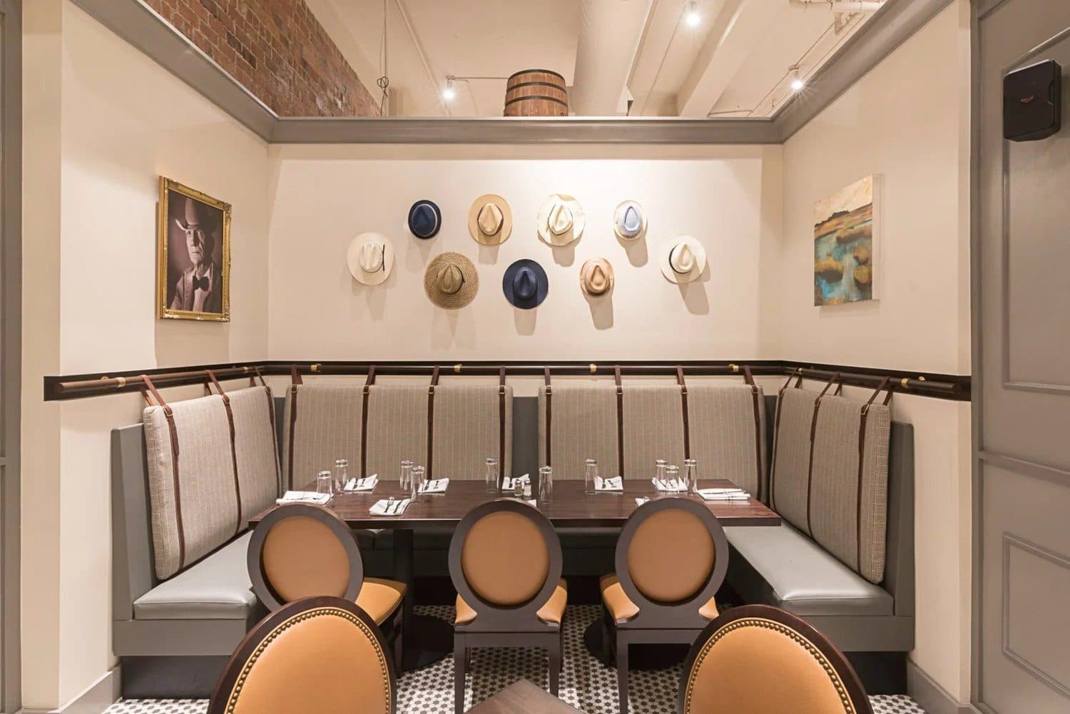 A private dining room at Bubba with hats on the wall