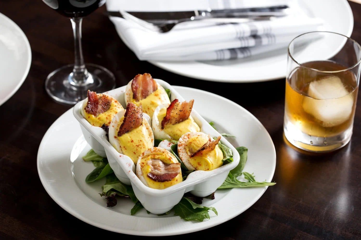Deviled eggs topped with pecan-smoked bacon at Bubba