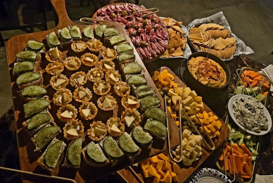 Catering spread of appetizers and fruit from Five Points