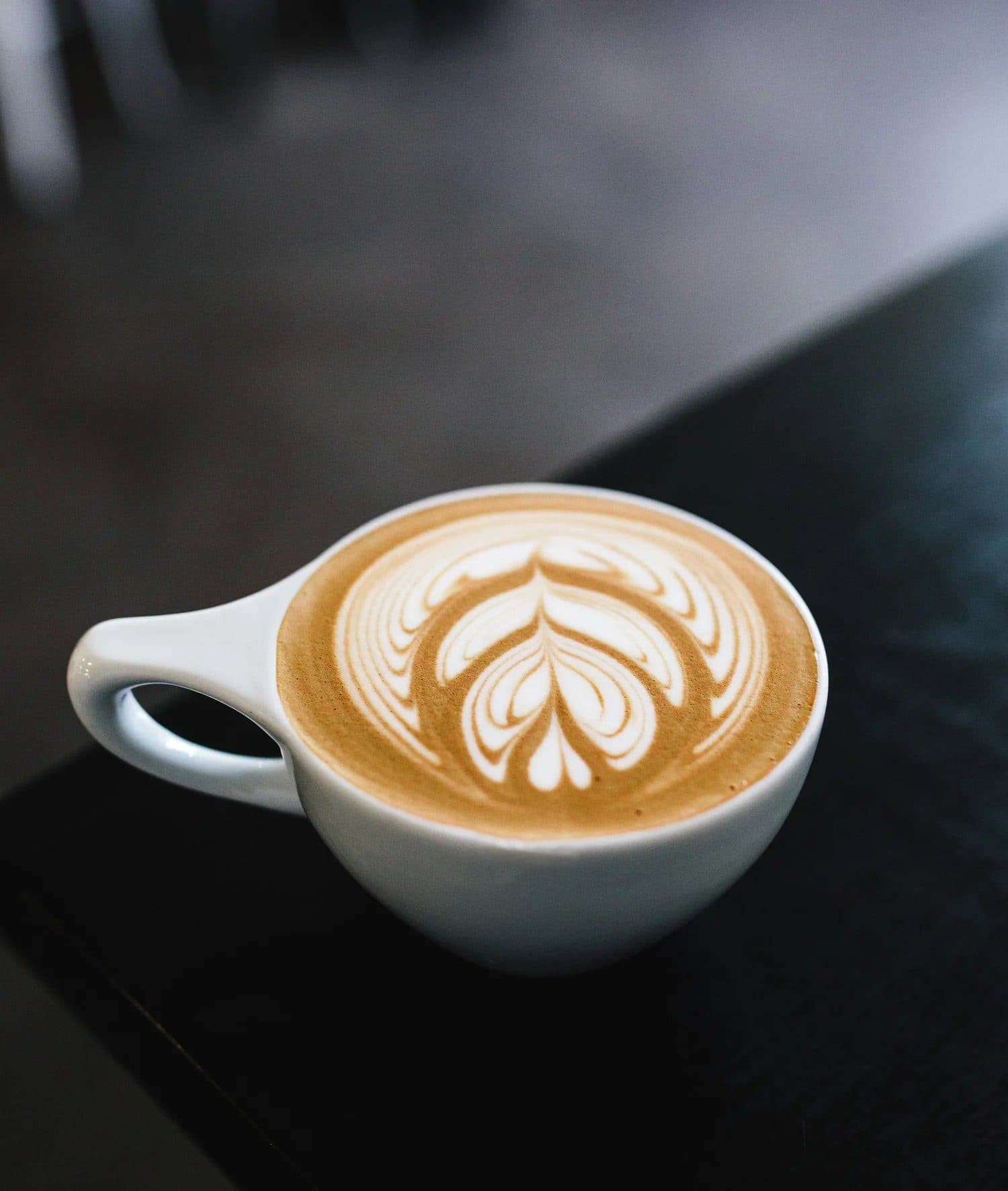 A latte with leaf art at Horizon Line