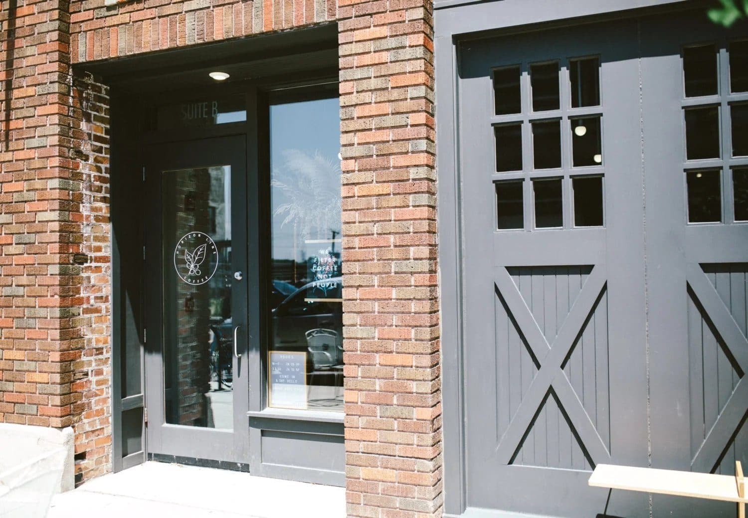 The gray double doors at Horizon Line Coffee on Walnut