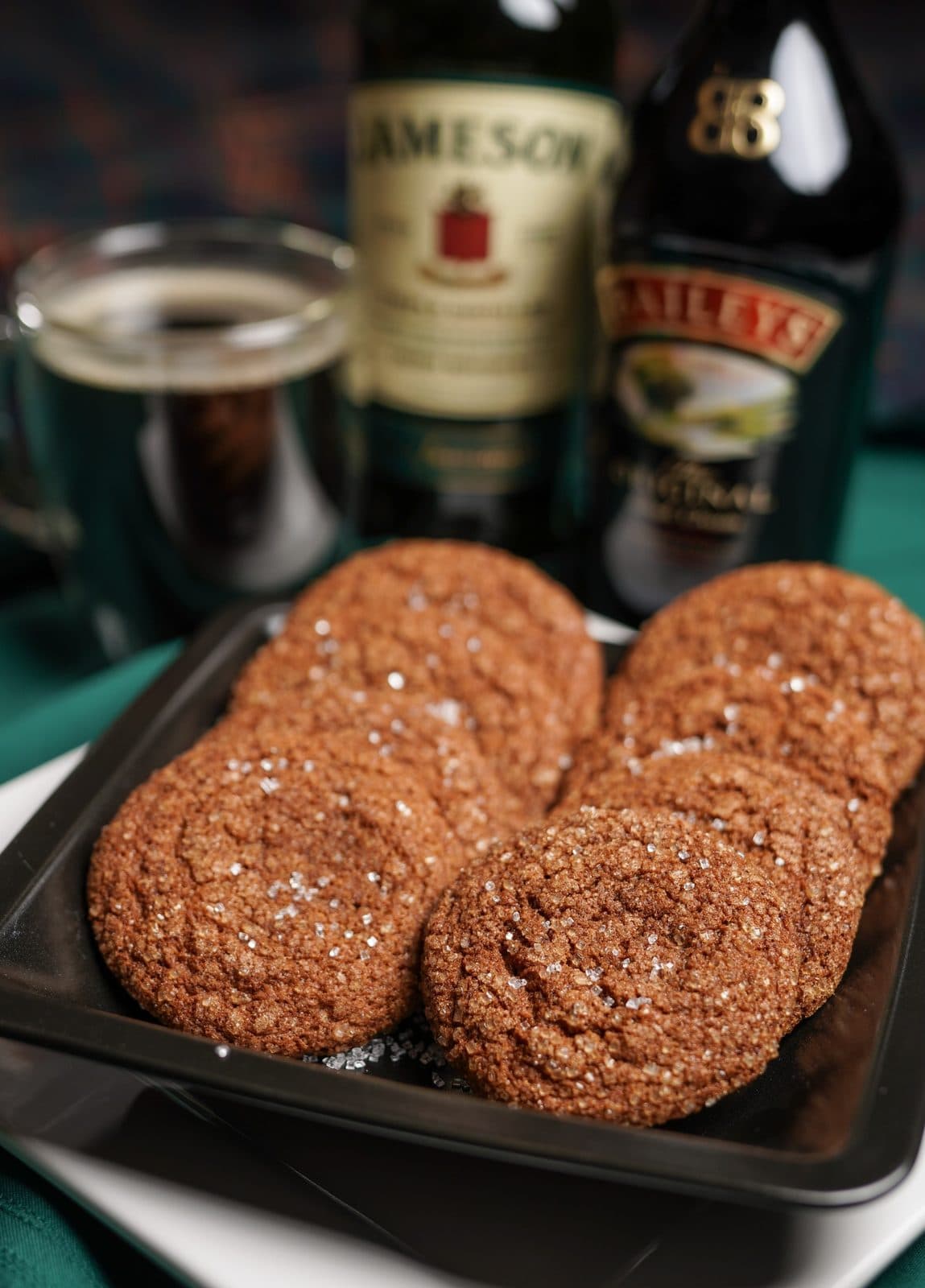 Irish Coffee Cookies on a tray with Jameson and Baileys behind them