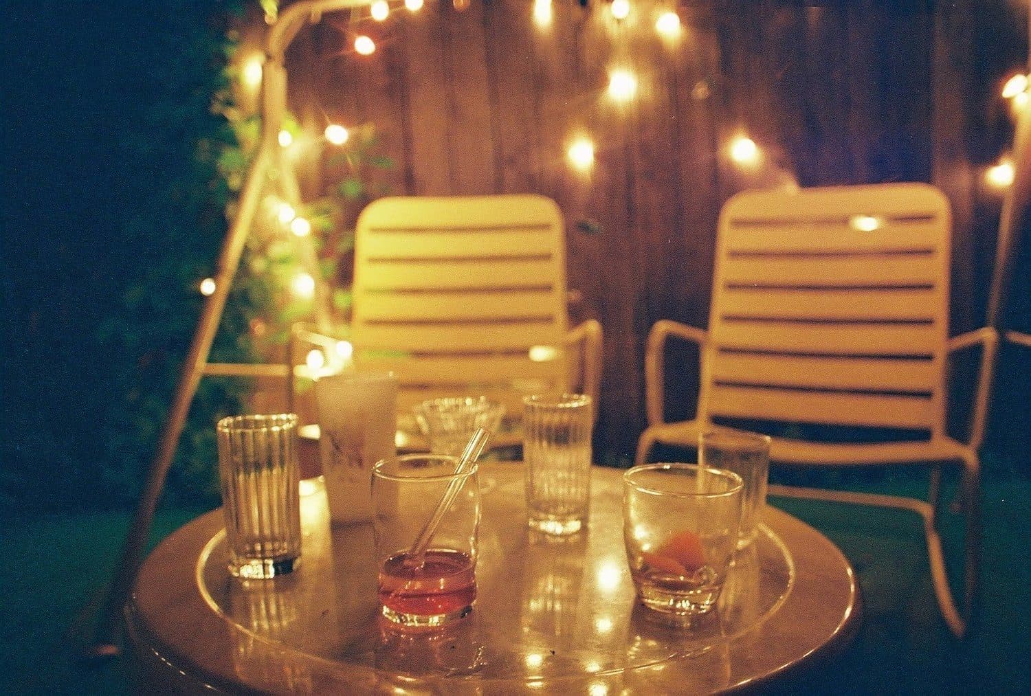 String-lit patio seating at The Bartender's Handshake