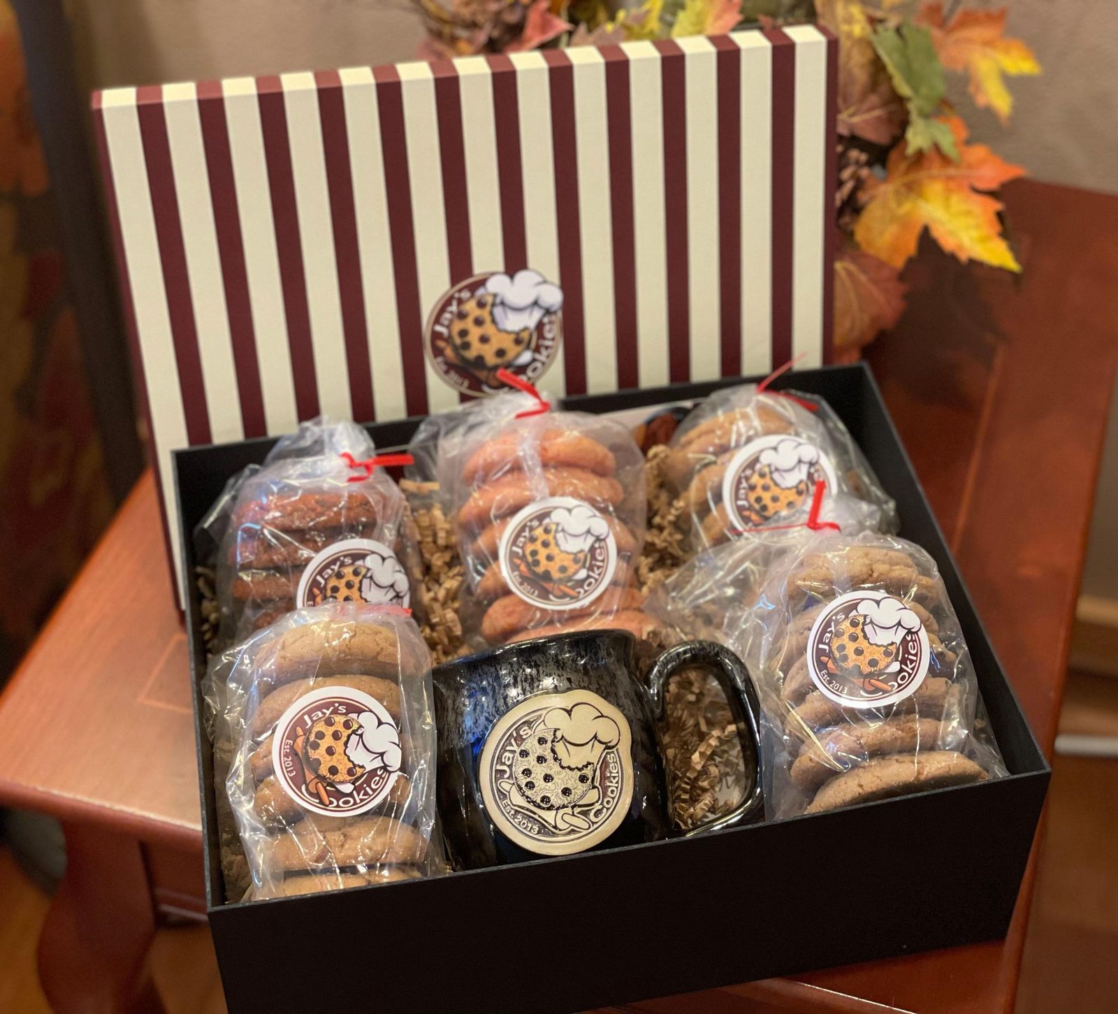 Gift box filled with wrapped bags of Jay's Cookies